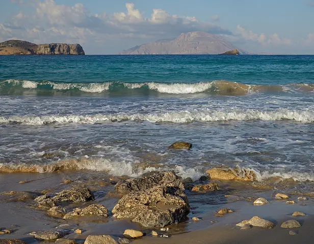 Agios Nikolaos beach at Arkasa on Karpathos' west coast, with Kassos behind