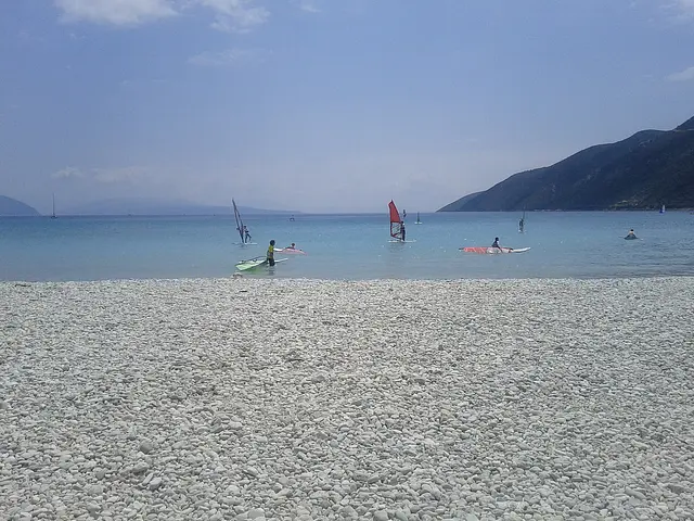 Windsurfers off the pebble beach at Vasiliki